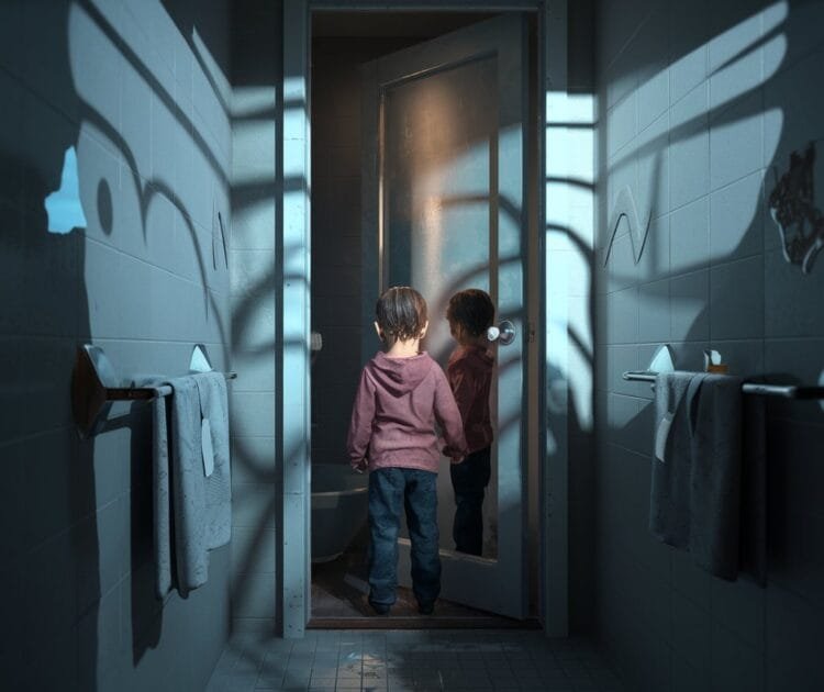 child standing in the doorway of a scary bathroom